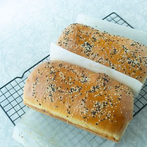 fresh baked bread loaves on rack