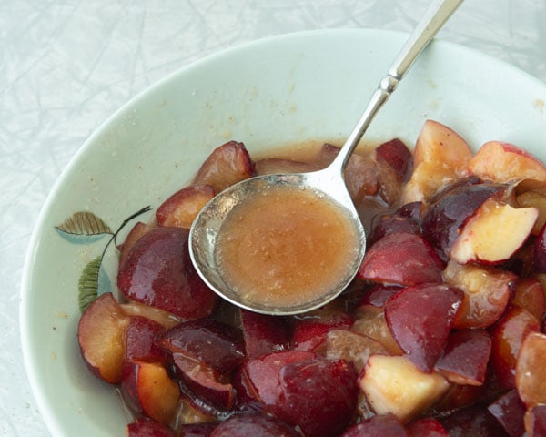 plum juice in a bowl of plums