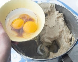 adding eggs to creamed butter and sugar