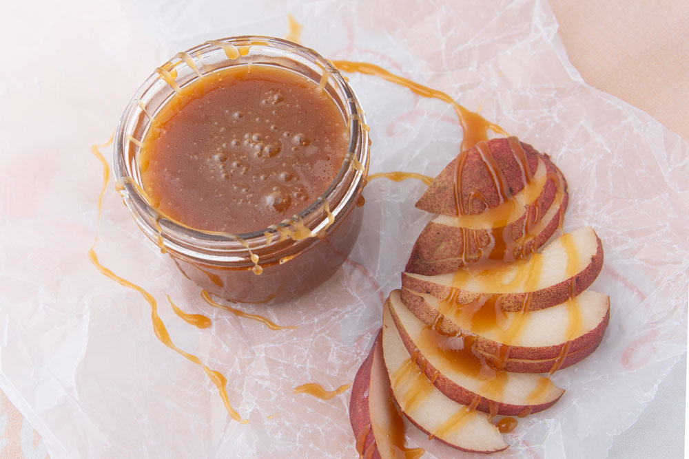 vegan caramel sauce on sliced pears