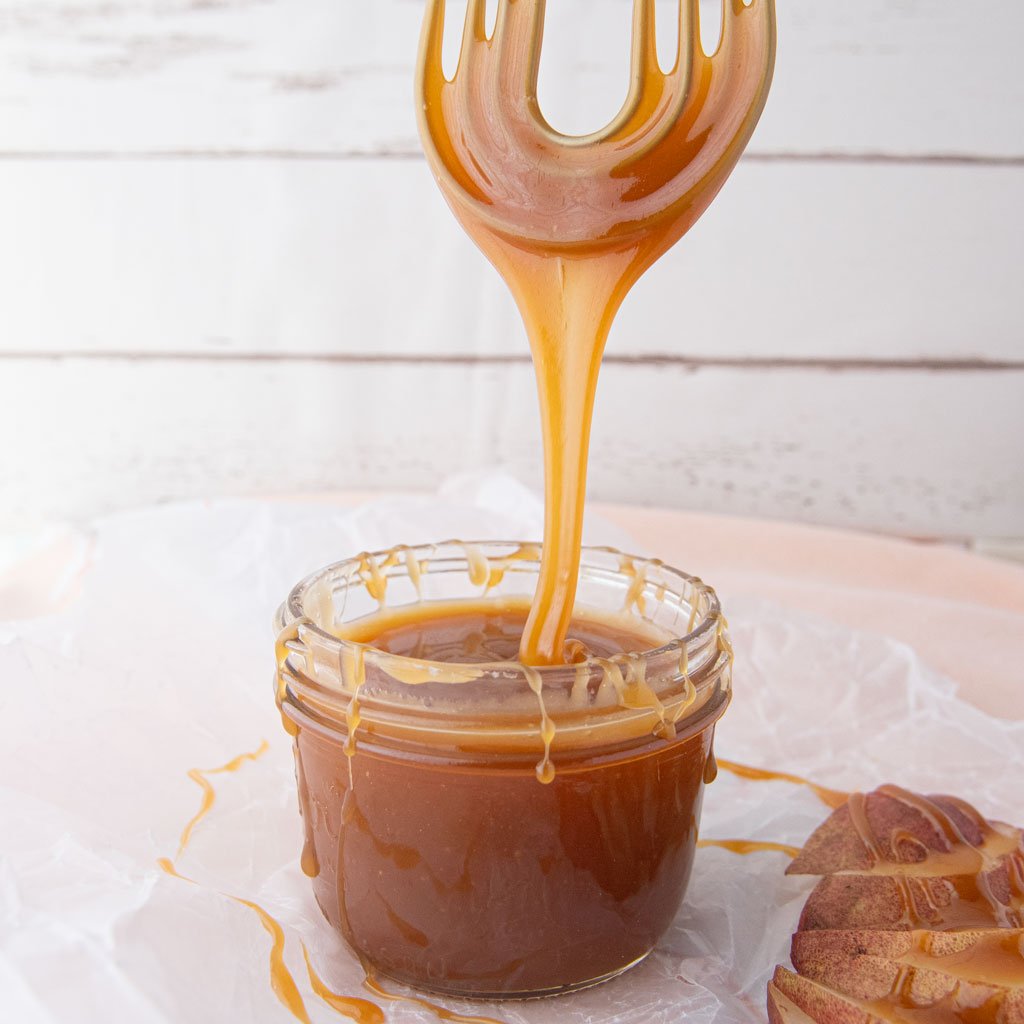 vegan caramel sauce dripping off whisk