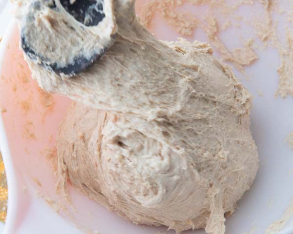 stretching and folding dough on itself