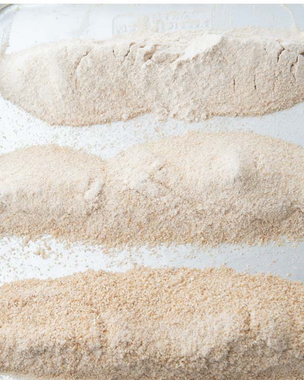 fine ground flour, medium grind flour, coarse flour on a tray