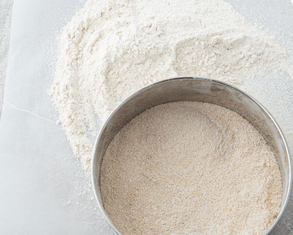 sifting soft wheat flour in sieve