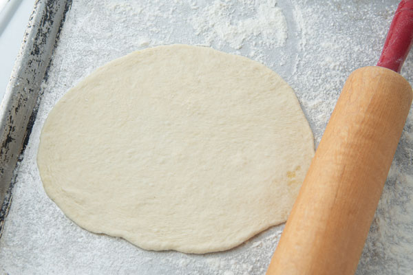 pita bread rolled and ready to bake