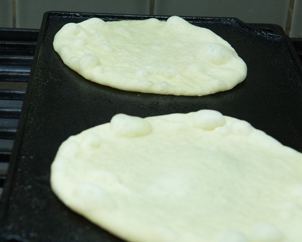 pita dough on cast iron griddle