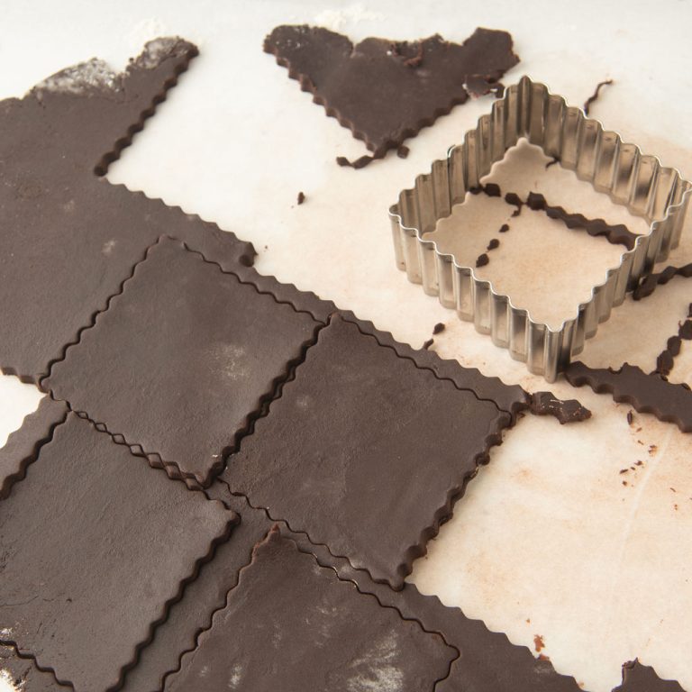 chocolate cut-out cookies and cookie cutter