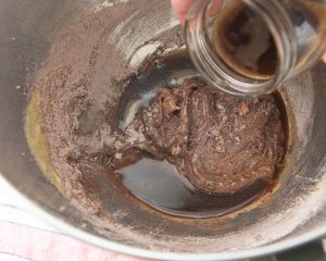 adding coffee to chocolate drop cookie batter