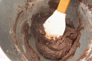 mixing chocolate drop cookie batter