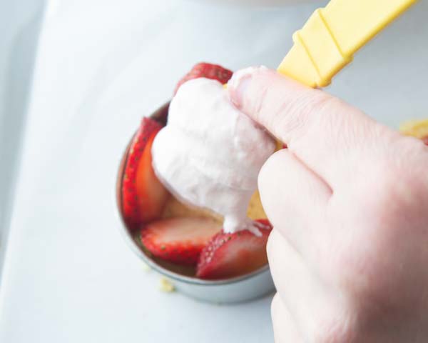 adding cream to top of cake