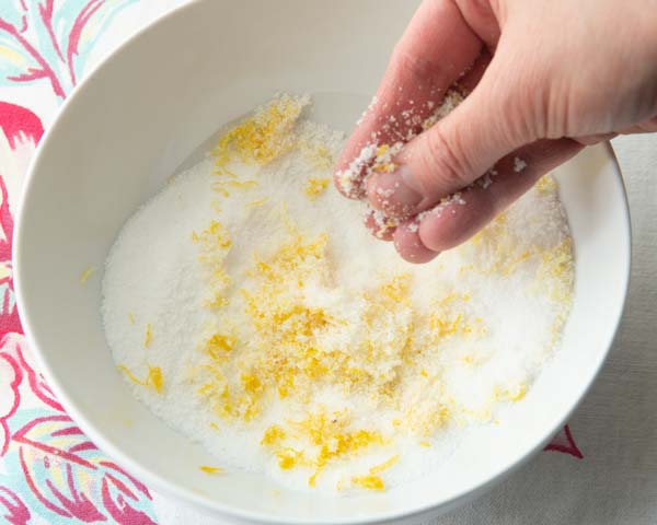 rubbing lemon zest into sugar