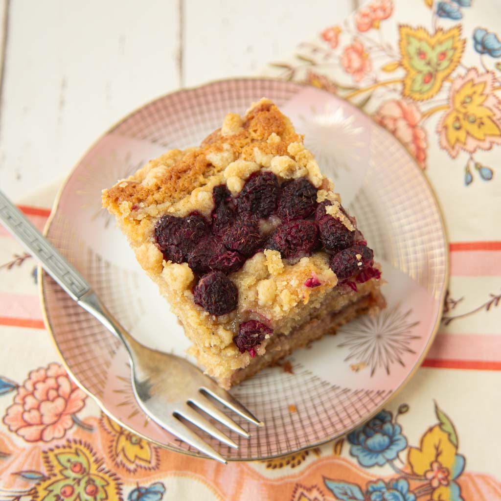 raspberry sour cream coffee cake on plate