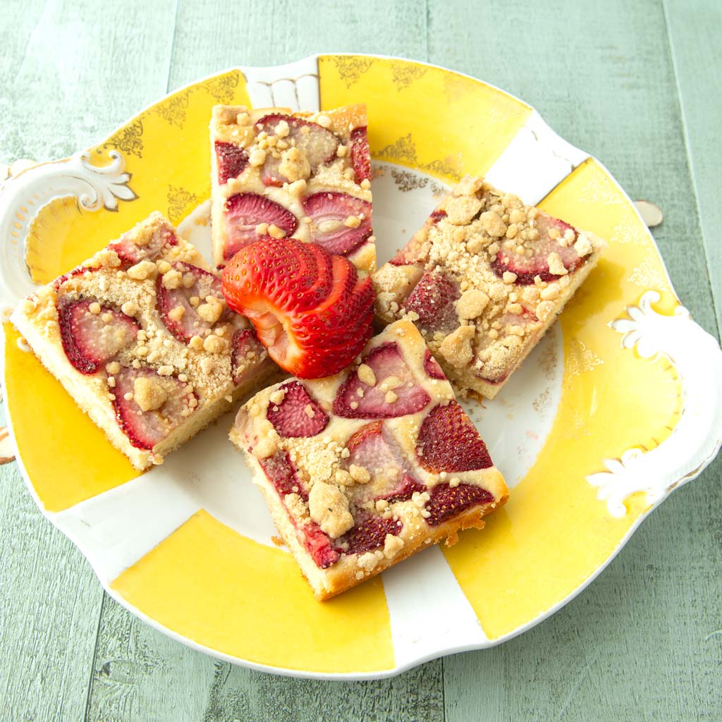 pieces of strawberry sheet cake on plate