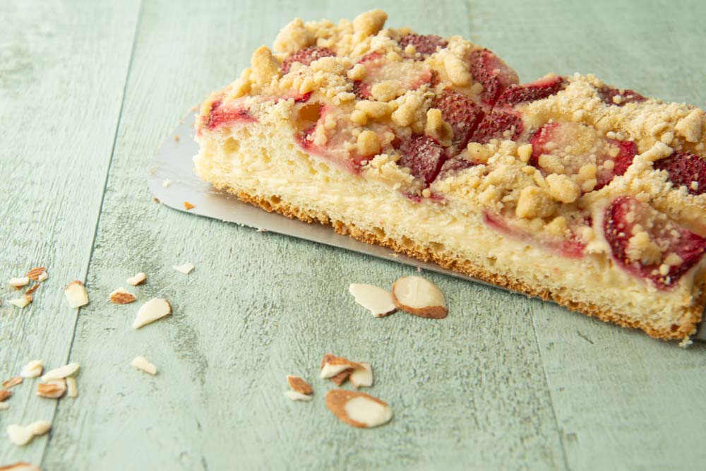piece of strawberry sheet cake on spatula