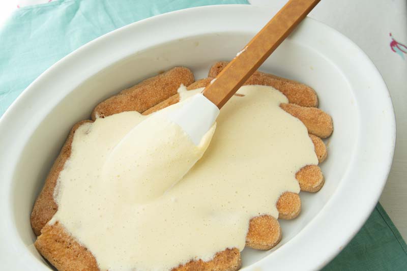covering ladyfinger cookies with mascarpone cream