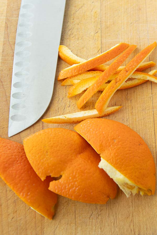 cutting orange peels into strips