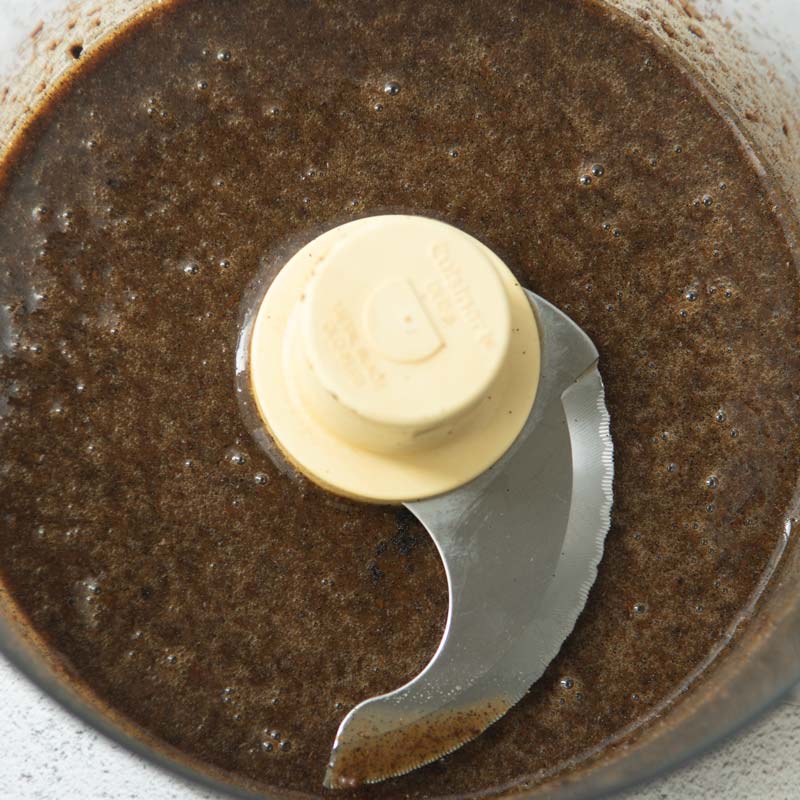 unstrained homemade vanilla paste in food processor bowl
