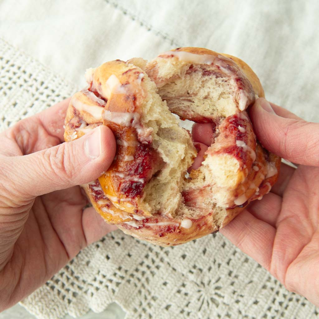 breaking open strawberry jam roll