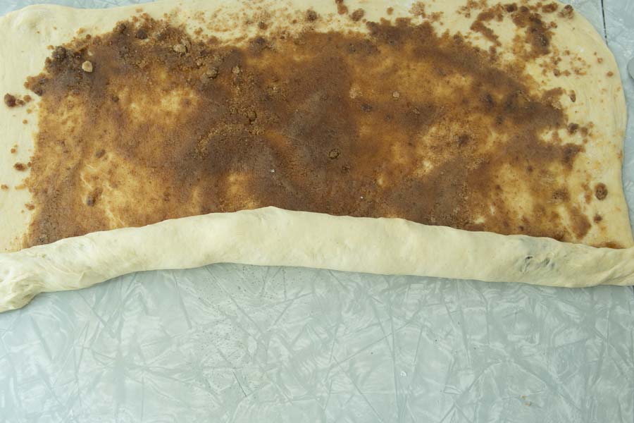 rolling up overnight cinnamon rolls