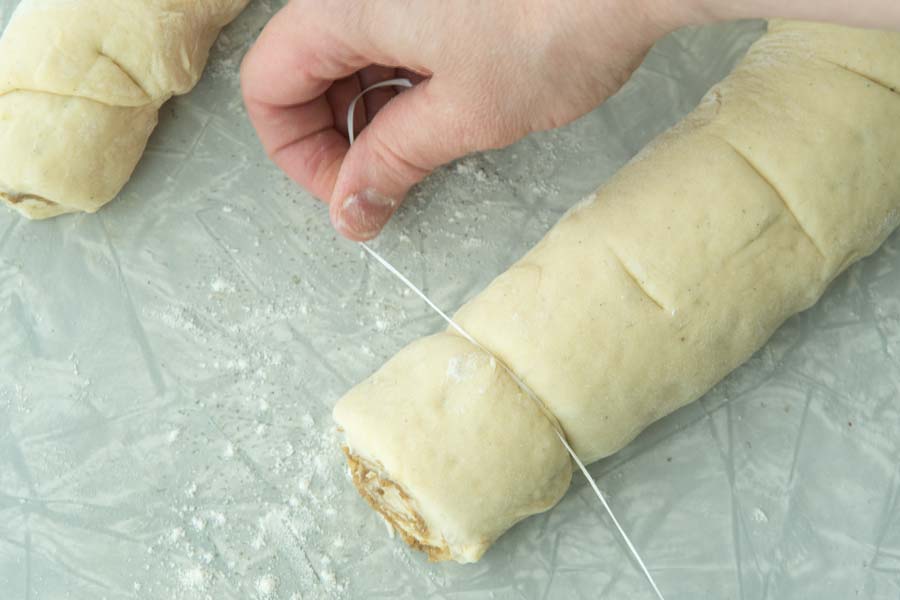 using floss to cut cinnamon rolls