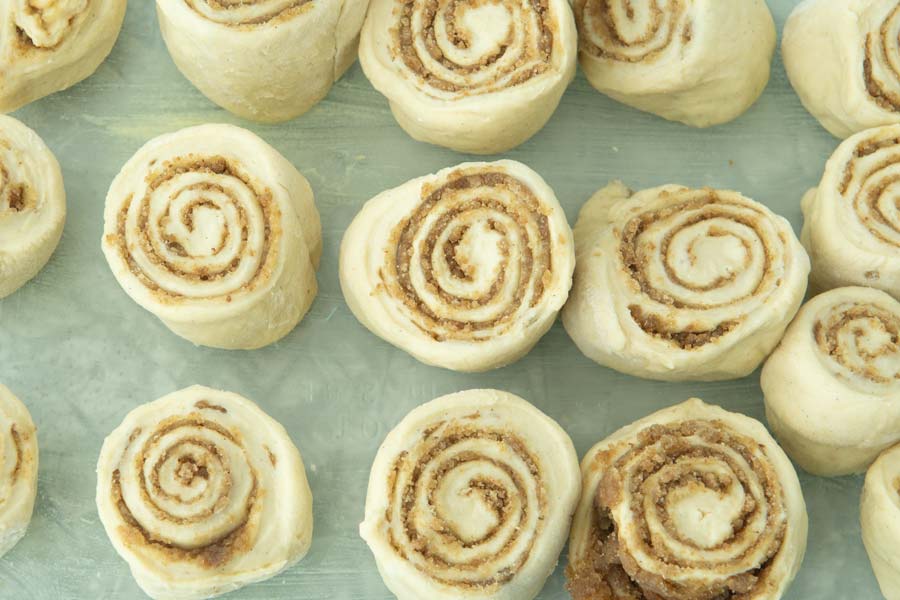 cinnamon rolls in glass dish unbaked