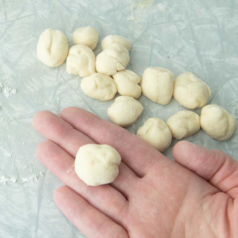 rolling small balls of dough