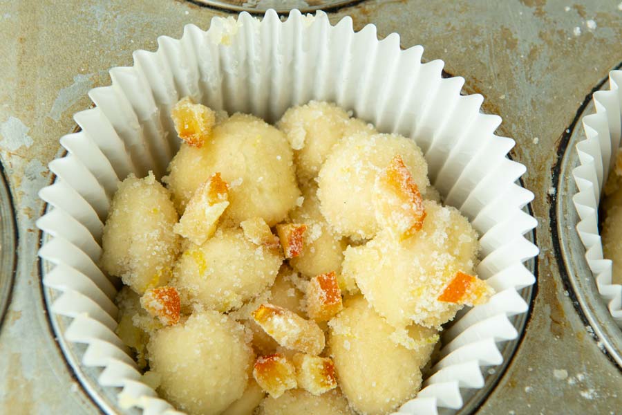 candied orange zest on unbaked lemon monkey bread muffin