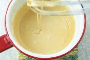 warm eggs and sugar on whisk