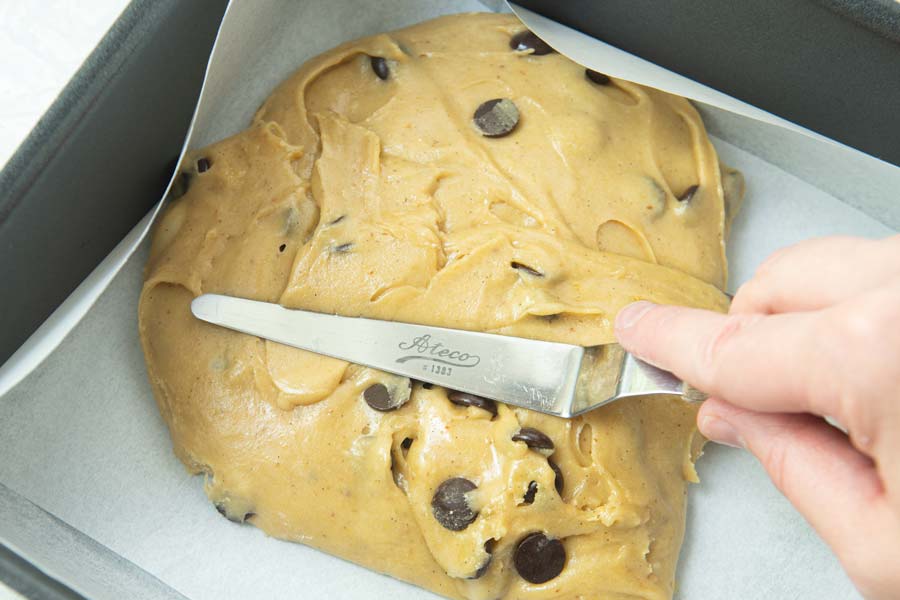 spreading brown butter blondies in pan