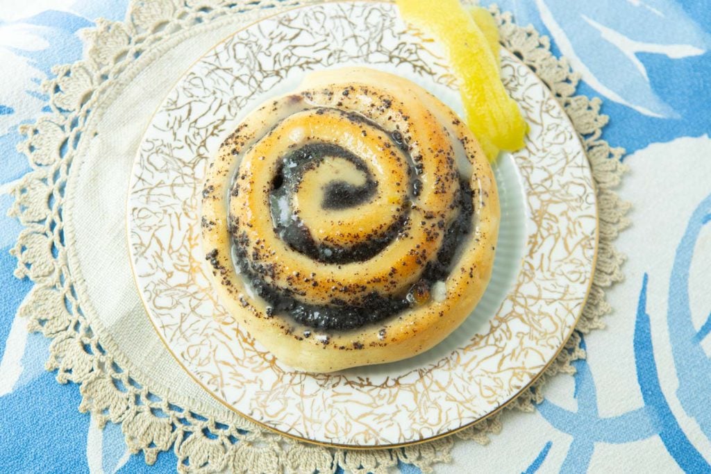 poppy seed roll on plate with lemon