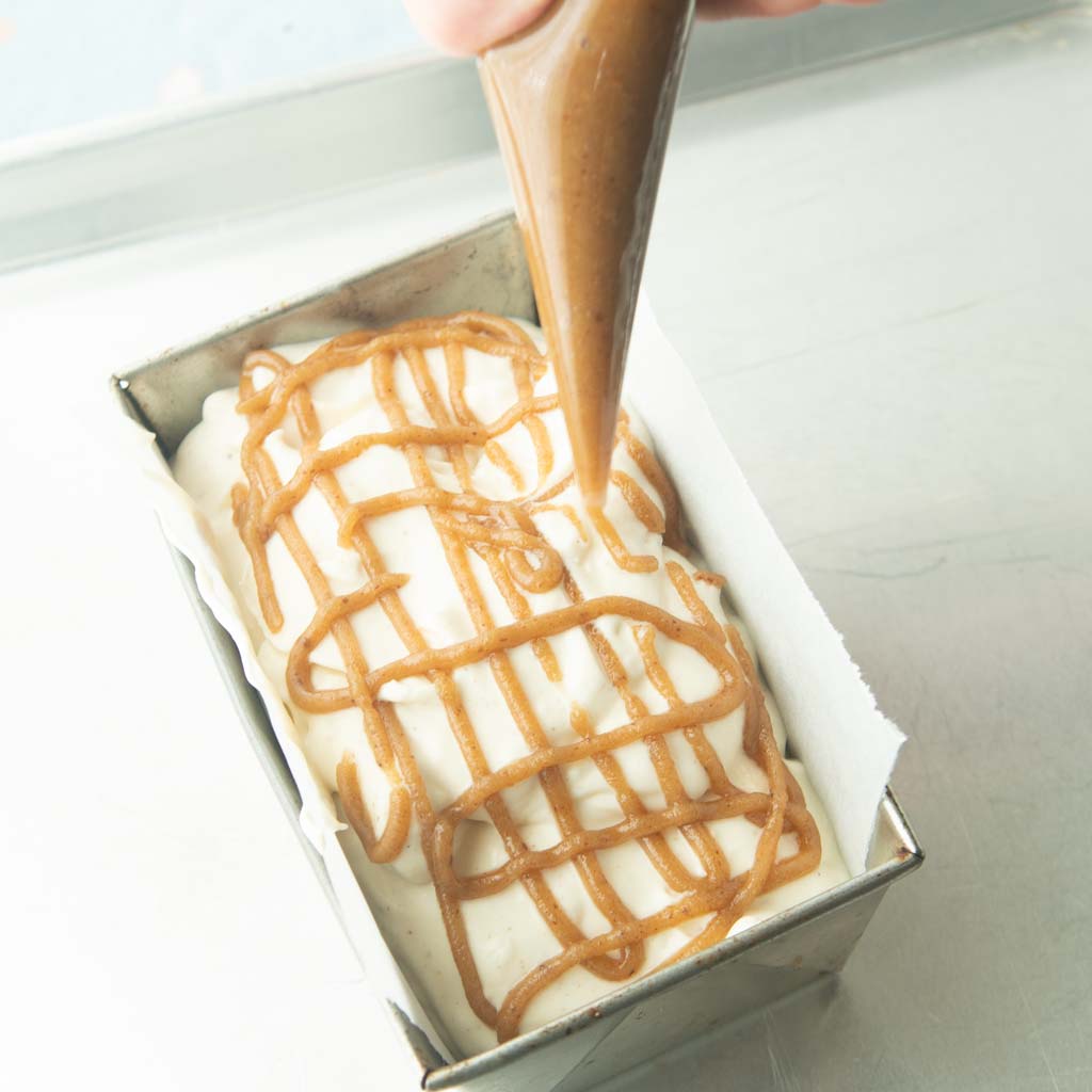 piping brown sugar caramel on top ice cream