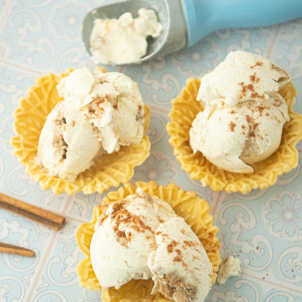 cinnamon ice cream in pizelle waffle cups and ice cream scoop