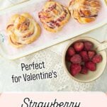 strawberry jam rolls on plate surrounded by empty jar of jam, and berries, text overlay