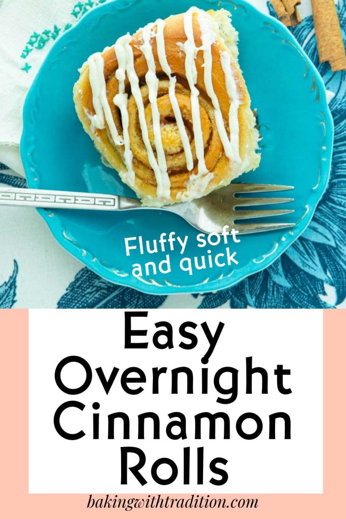 overnight cinnamon roll on plate with fork, napkin and cinnamon sticks