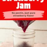 strawberry jam being poured into jar, text overlay