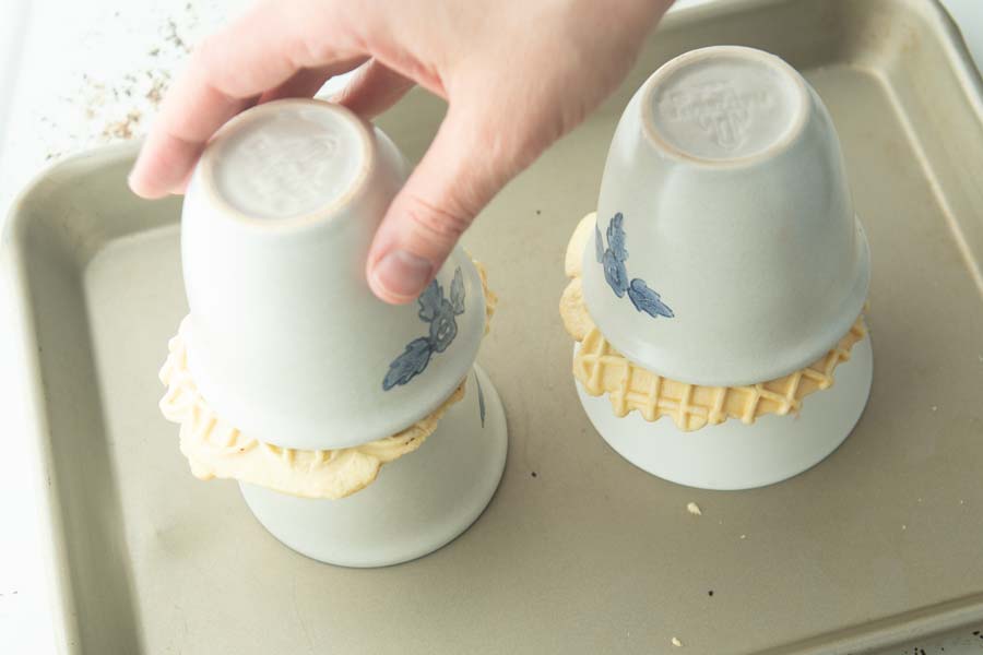 pressing waffle cups between ramekins