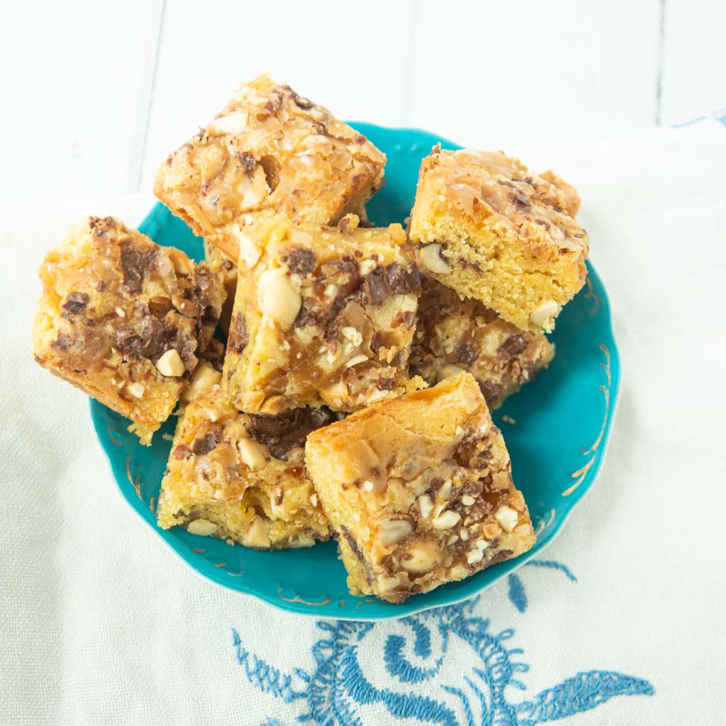 caramel peanut chocolate blondies on plate