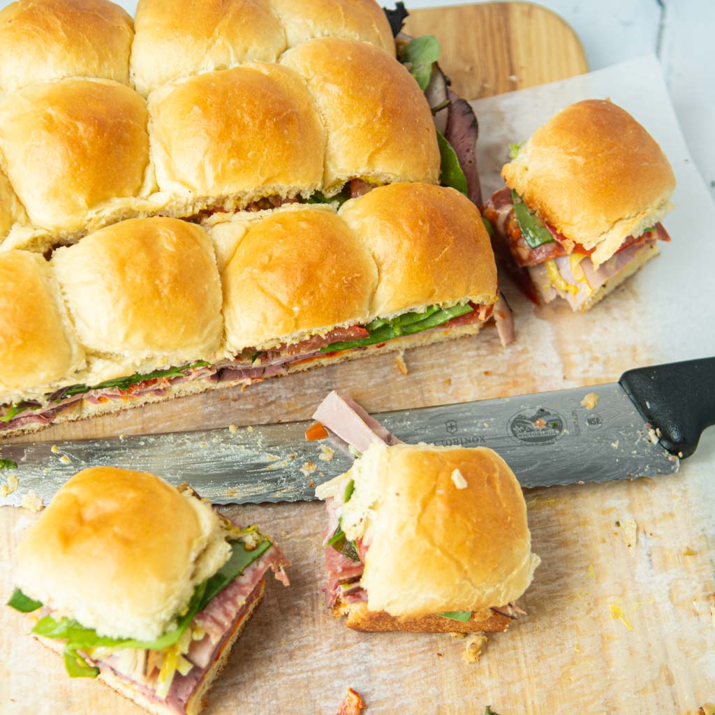cut sandwiches on Hawaiian sweet rolls