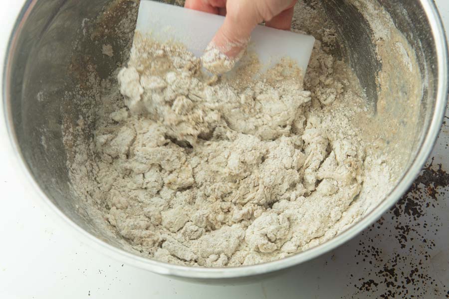 forming shaggy dough with bowl scraper