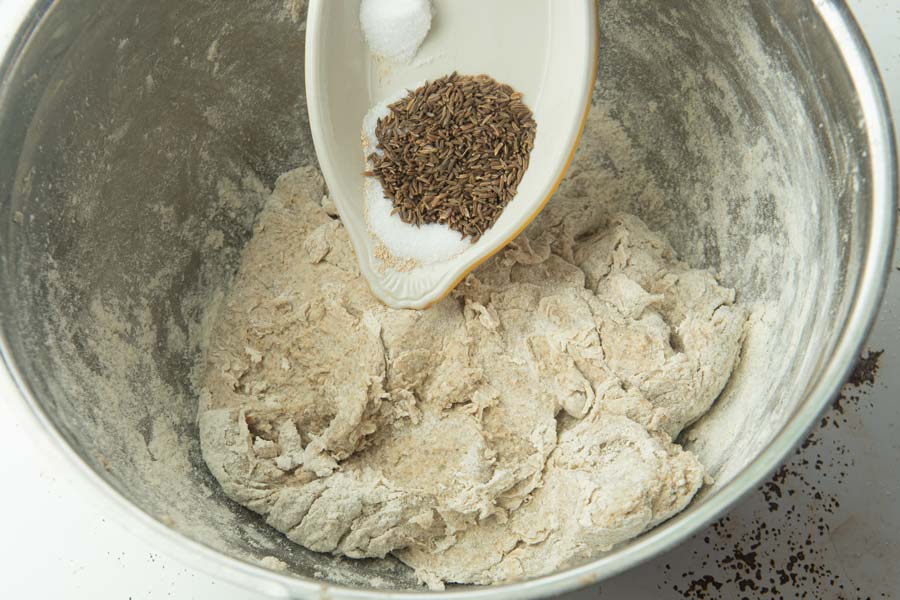 adding caraway and salt to rye dough