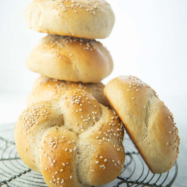 homemade hamburger buns in a stack