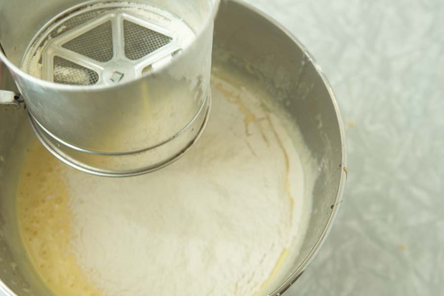 sifting flour into cake batter