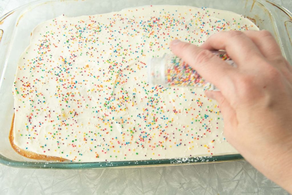 adding sprinkles over cream cheese icing