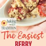 closeup of a serving of strawberry crisp in a dish with text overlay
