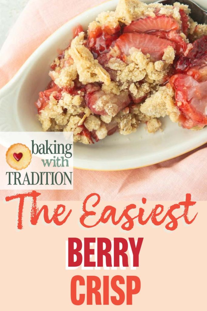 closeup of a serving of strawberry crisp in a dish with text overlay