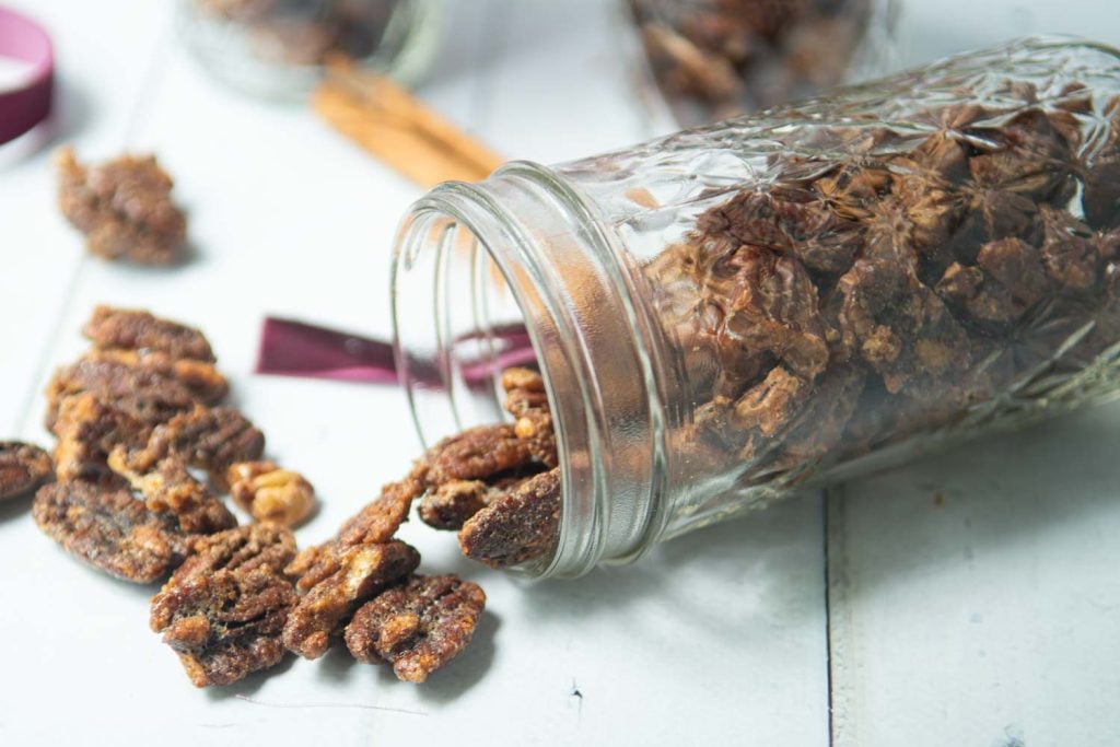 candied maple pecans in jars with cinnamon