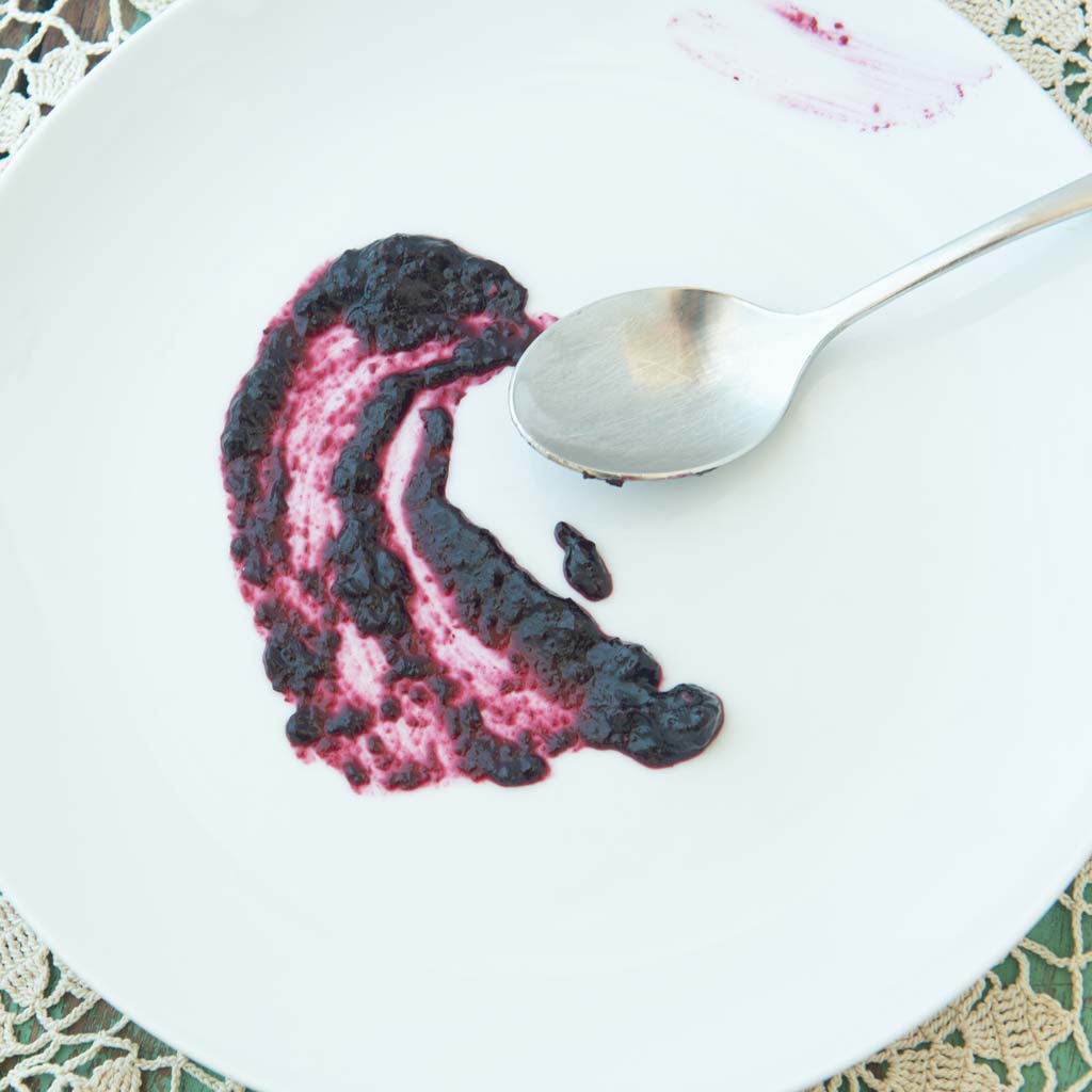 blueberry jam on plate with spoon
