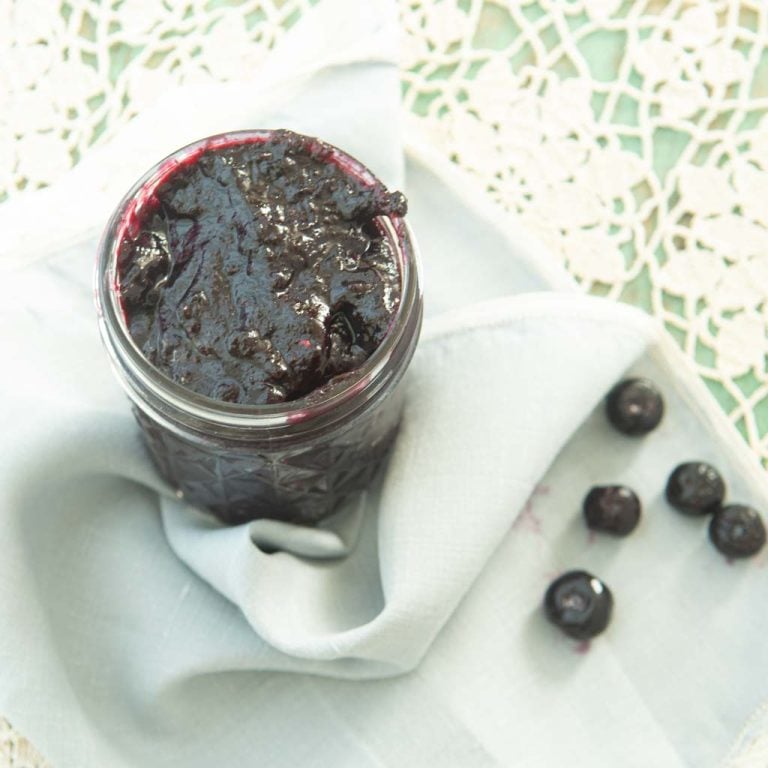 blueberry jam in jar with blueberries