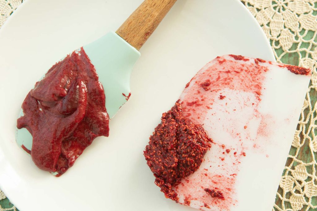 strained raspberry jam vs. seeds on a plate