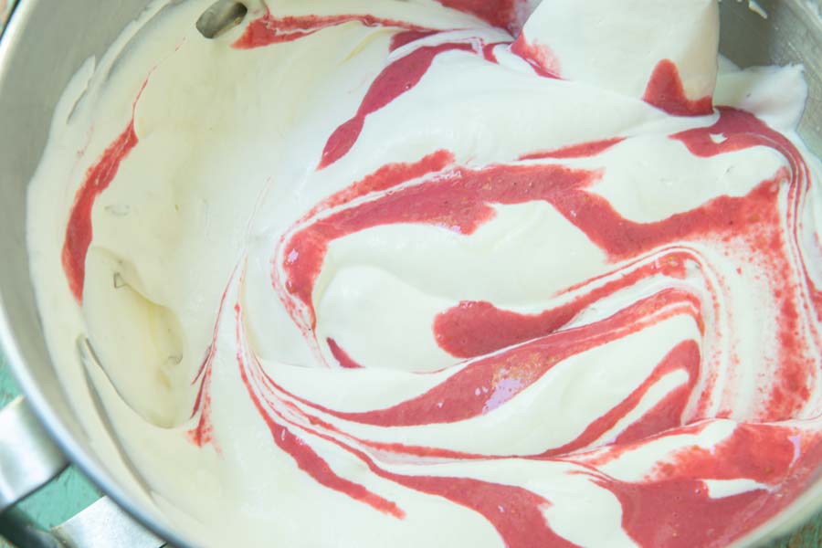 swirling raspberry puree into ice cream